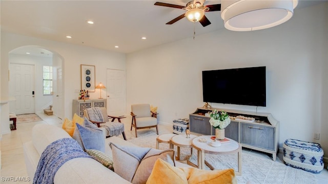 living room featuring light tile patterned flooring and ceiling fan