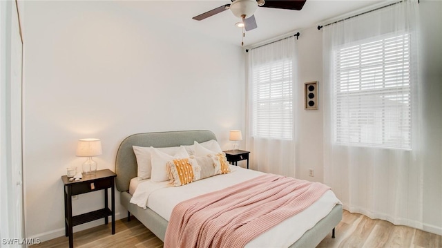 bedroom featuring ceiling fan and light hardwood / wood-style flooring