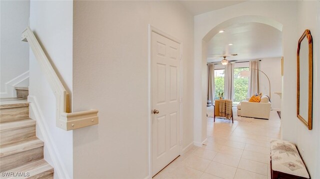 hall with light tile patterned floors