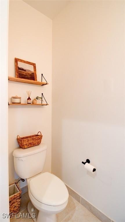 bathroom with tile patterned floors and toilet