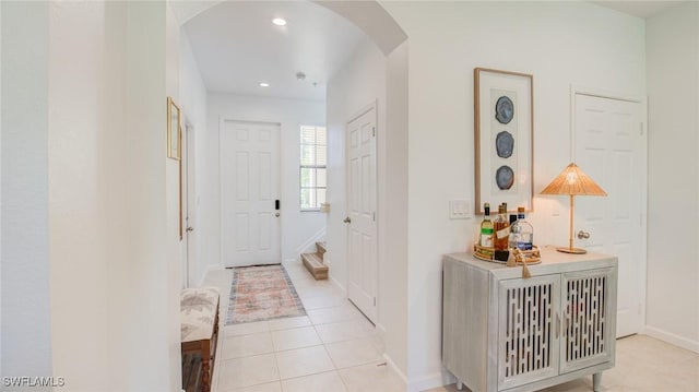 hallway with light tile patterned floors