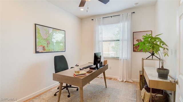 office space with ceiling fan and light wood-type flooring