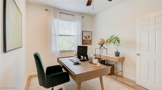 office with ceiling fan and light wood-type flooring