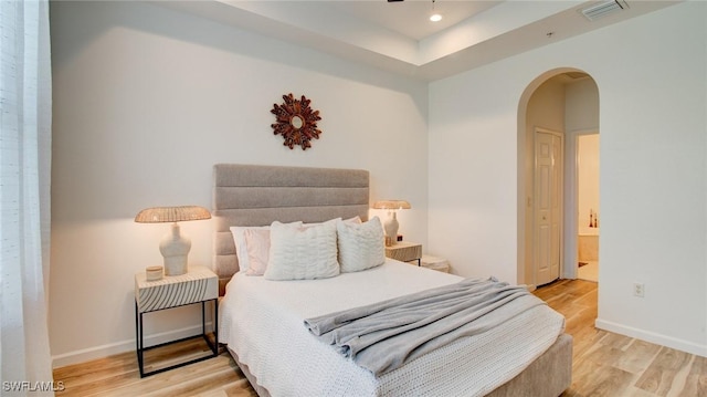 bedroom with light wood-type flooring