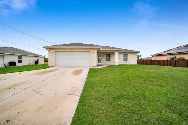 view of front of house featuring a front lawn, central air condition unit, and a garage