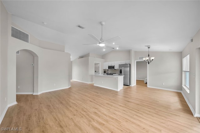 unfurnished living room featuring ceiling fan with notable chandelier, sink, light hardwood / wood-style flooring, and lofted ceiling