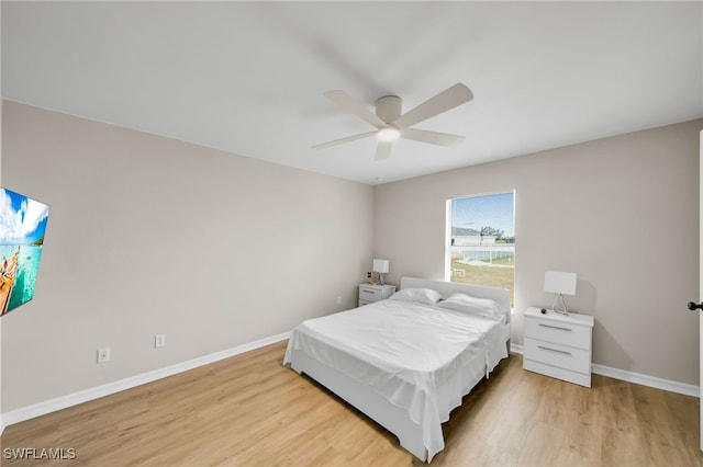 bedroom featuring ceiling fan and light hardwood / wood-style flooring