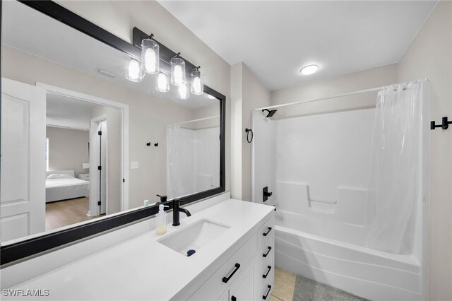 bathroom featuring vanity and shower / bath combination with curtain