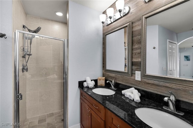 bathroom with vanity and a shower with shower door