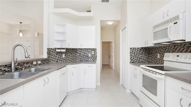 2876 Orange Grove Trl, Naples, FL 34120 - kitchen featuring white appliances, a sink, open shelves, tasteful backsplash, and light tile patterned floors