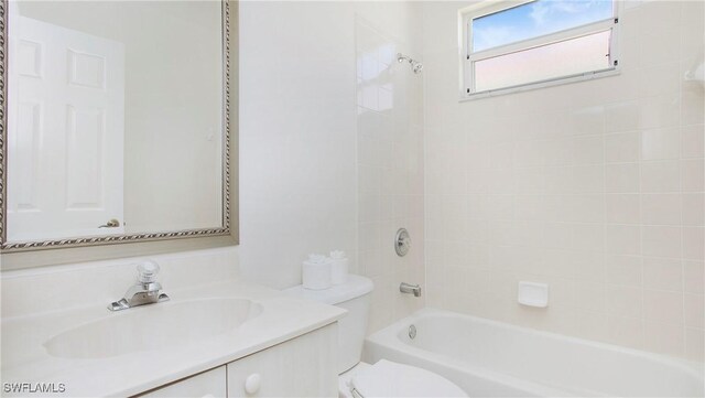 2876 Orange Grove Trl, Naples, FL 34120 - bathroom with toilet, vanity, and  shower combination