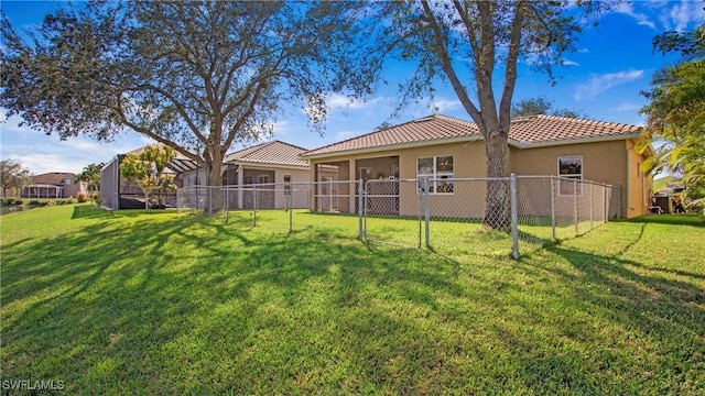 2876 Orange Grove Trl, Naples, FL 34120 - back of property featuring stucco siding and a tiled roof