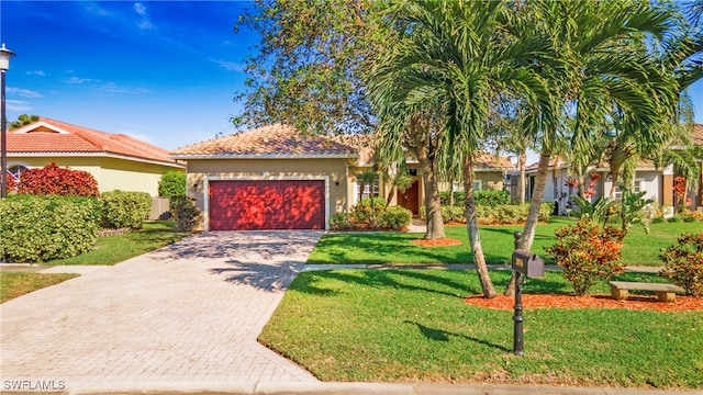 mediterranean / spanish home featuring a front yard