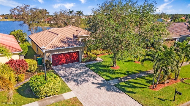 birds eye view of property with a water view