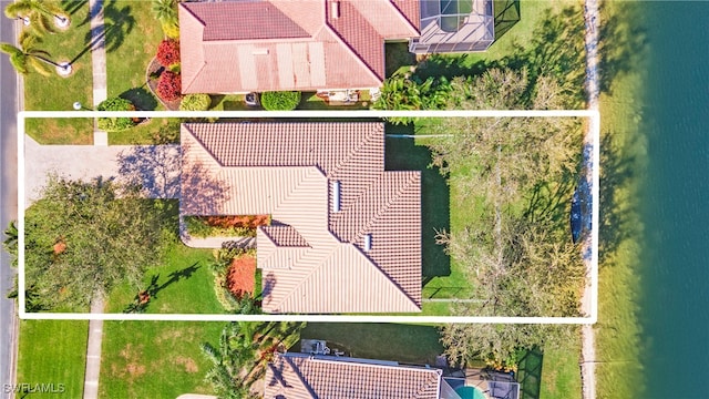 birds eye view of property featuring a water view