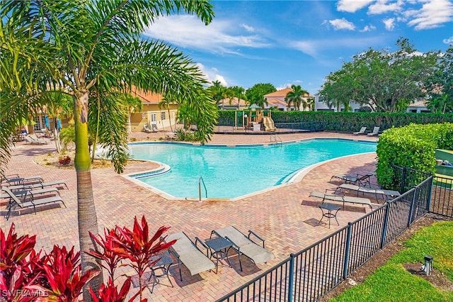 view of swimming pool with a patio