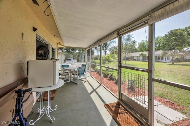 unfurnished sunroom with a healthy amount of sunlight