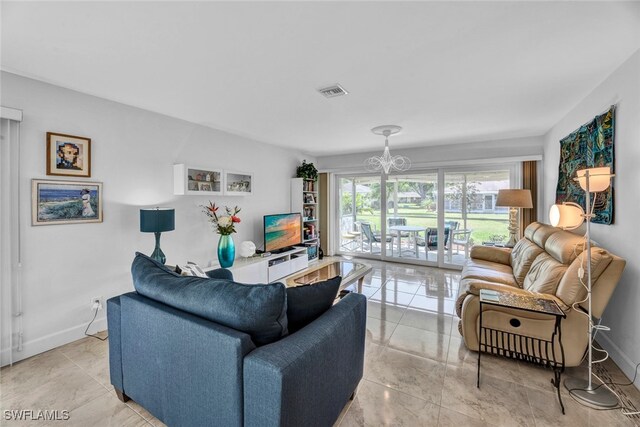 living room with a notable chandelier