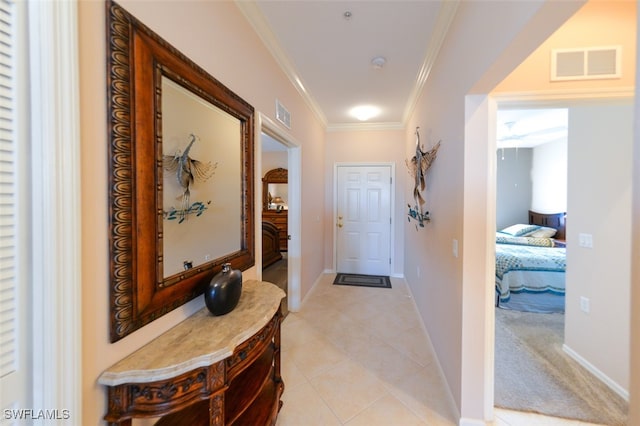 corridor with light colored carpet and ornamental molding