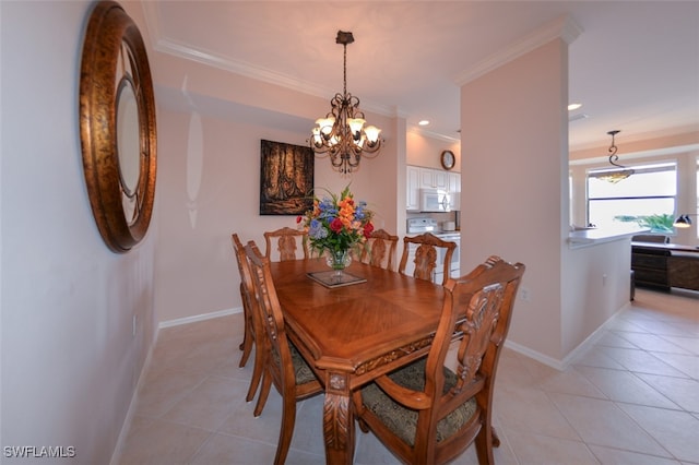 tiled dining area featuring ornamental molding and an inviting chandelier