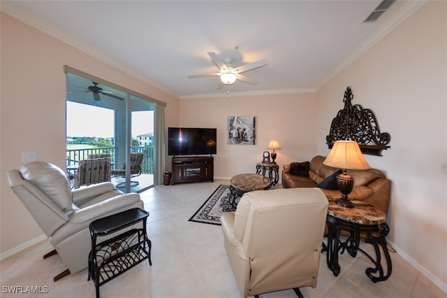 tiled living room with ceiling fan and crown molding