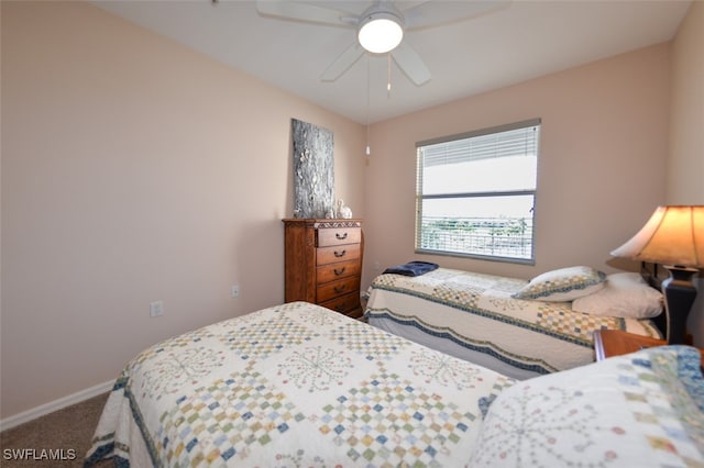 bedroom with ceiling fan and carpet