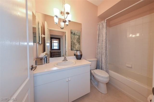 full bathroom with a notable chandelier, tile patterned floors, toilet, shower / bath combo with shower curtain, and vanity