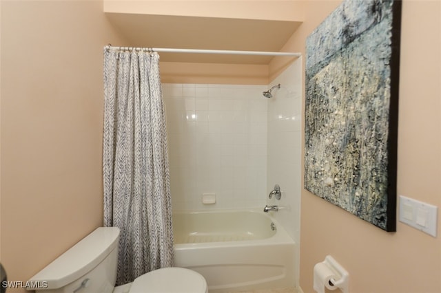 bathroom featuring toilet and shower / tub combo with curtain