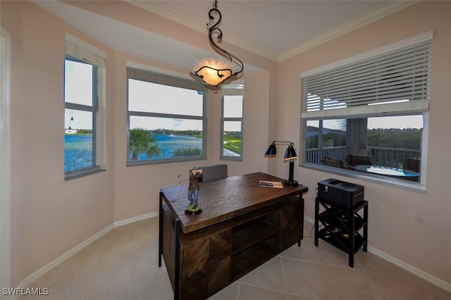 tiled office featuring a healthy amount of sunlight, a water view, and ornamental molding