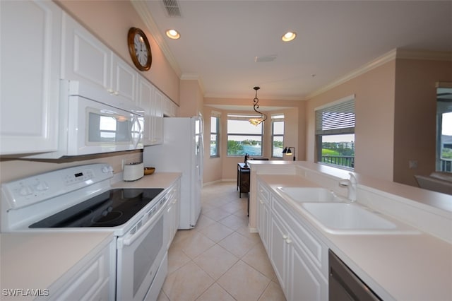 kitchen with white cabinetry, sink, decorative light fixtures, and white appliances