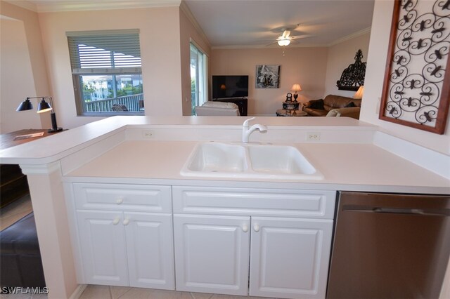 kitchen featuring dishwasher, sink, kitchen peninsula, crown molding, and white cabinets