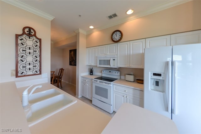 kitchen with white cabinets, crown molding, white appliances, and sink