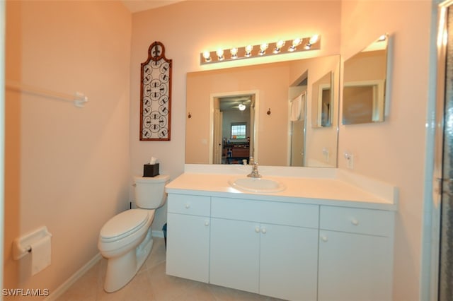 bathroom featuring tile patterned floors, vanity, and toilet