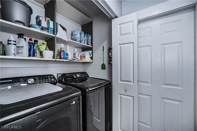 laundry area featuring washing machine and clothes dryer