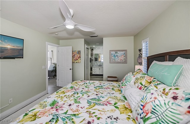 bedroom with connected bathroom and ceiling fan