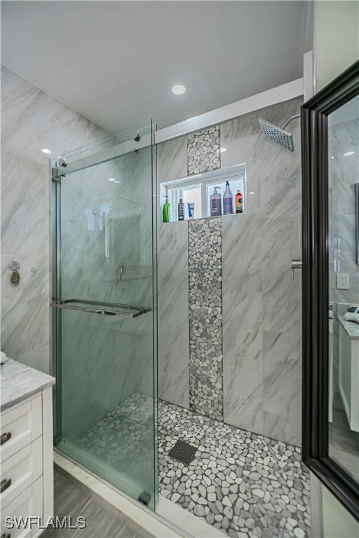 bathroom with vanity and an enclosed shower