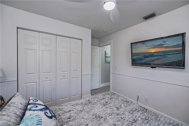 bedroom with ceiling fan and a closet