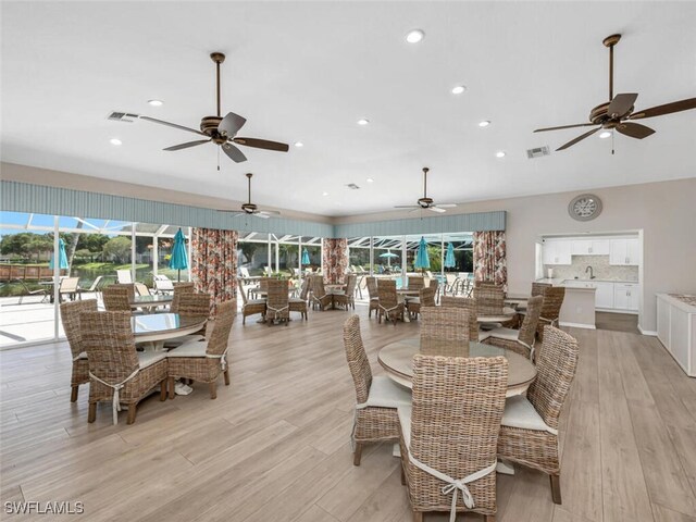 7576 Oleander Gate Dr Unit 101, Naples, FL 34109 - dining room featuring recessed lighting, light wood finished floors, and ceiling fan