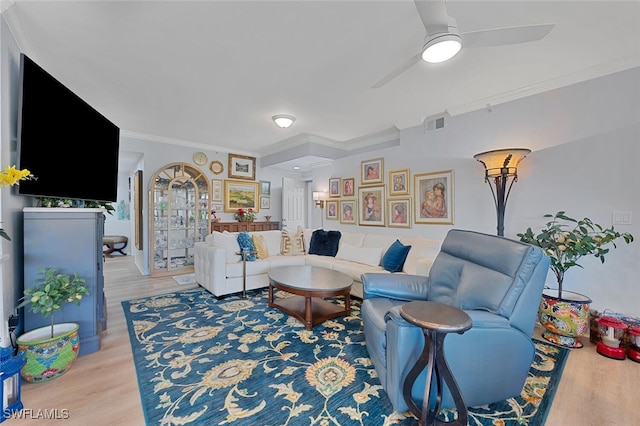 7576 Oleander Gate Dr Unit 101, Naples, FL 34109 - living area featuring light wood-style floors, ornamental molding, and a ceiling fan