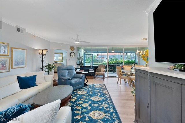 7576 Oleander Gate Dr Unit 101, Naples, FL 34109 - living room featuring crown molding, light wood-type flooring, and a ceiling fan