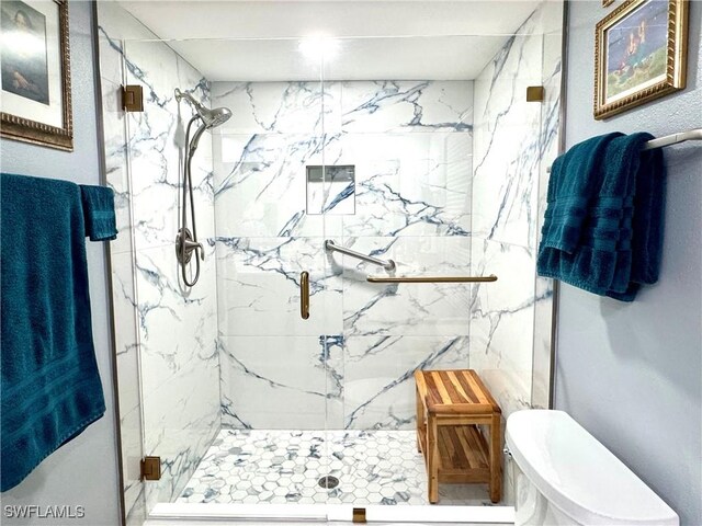 7576 Oleander Gate Dr Unit 101, Naples, FL 34109 - bathroom with toilet and a marble finish shower