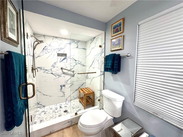 7576 Oleander Gate Dr Unit 101, Naples, FL 34109 - bathroom with toilet, a marble finish shower, and wood finished floors