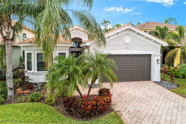 mediterranean / spanish house with a garage