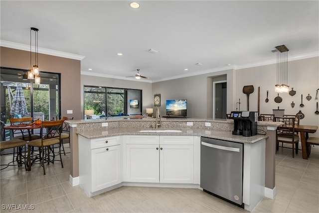 kitchen with decorative light fixtures, sink, white cabinets, dishwasher, and ceiling fan