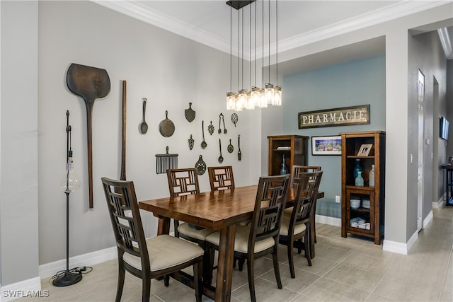 dining area featuring light tile patterned floors and crown molding