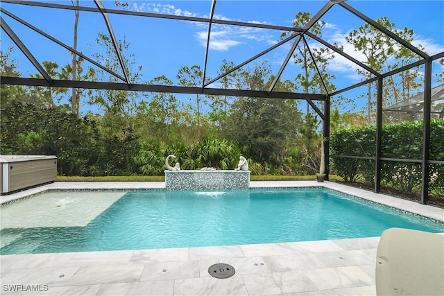 view of swimming pool featuring a lanai, pool water feature, and a patio area