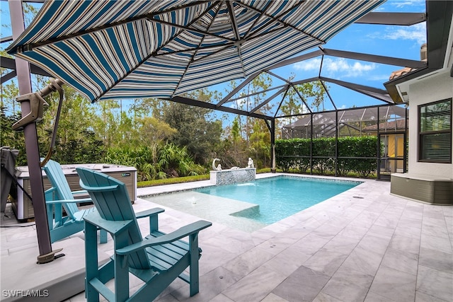 view of swimming pool featuring glass enclosure, pool water feature, and a patio area