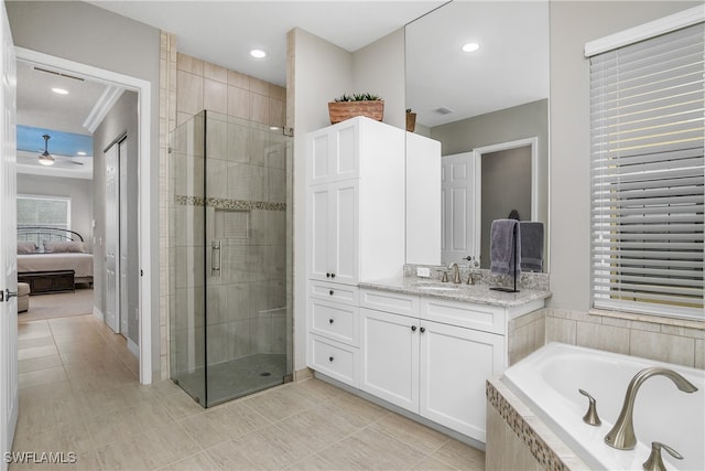 bathroom featuring tile patterned flooring, vanity, ceiling fan, and separate shower and tub