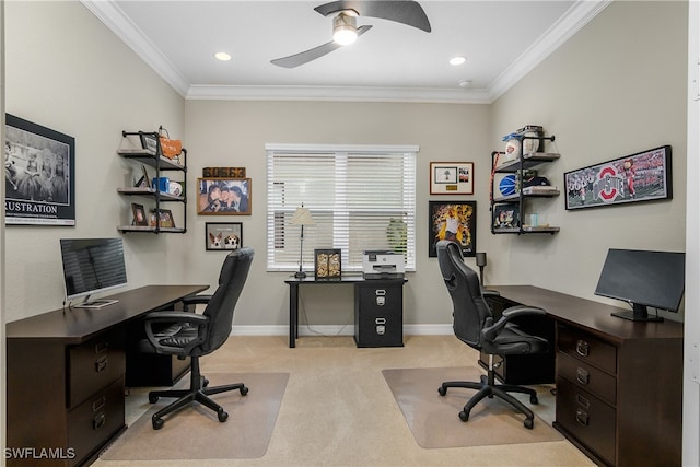 carpeted home office featuring ceiling fan and crown molding