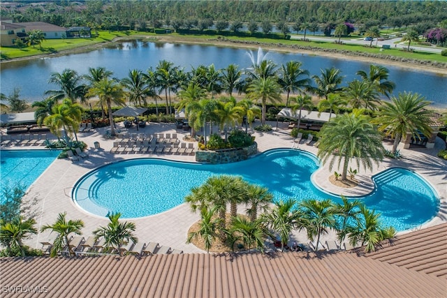 view of pool featuring a patio and a water view